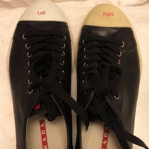 A pair leather Prada shoes
